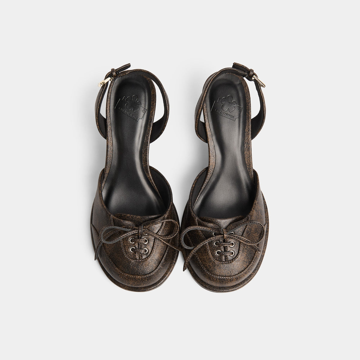 Rounded toe, balanced spirit — in the middle of something.
